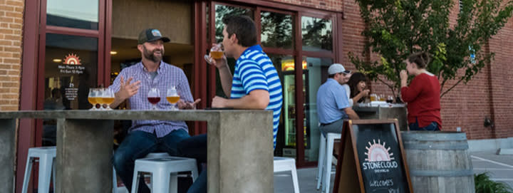 Two groups drinking beer on Stonecloud Brewing Company's taproom in Oklahoma City