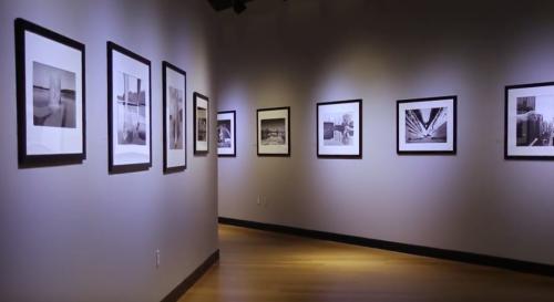 An exhibit hangs on the wall at Southeast Museum of Photography