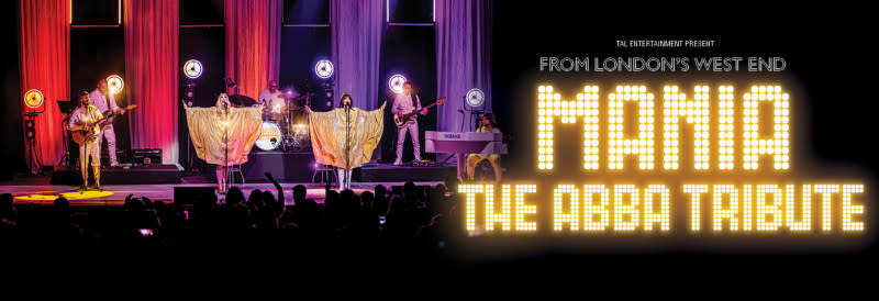People perform on stage during a MANIA: The ABBA Tribute concert