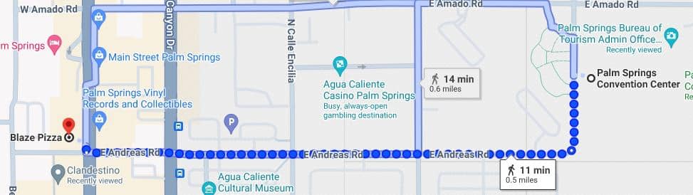A screenshot of a digital map showing a walking route from Blaze Pizza to a destination near Palm Springs Convention Center with two options: the top route takes 14 minutes and covers 0.6 miles, and the bottom route takes 11 minutes and covers 0.5 miles. Various points of interest are marked along the way.