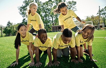 Kiddie Academy summer camp Kids in a pyramid formation