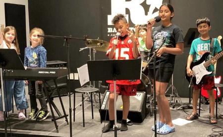 Kids on stage at rock n roll camp