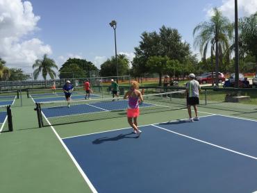 Members of the Peace River Picklers playing in a pickleball tournament at Pickleplex® of Punta Gorda