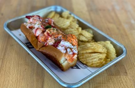 Lobster Roll and chips on a tray
