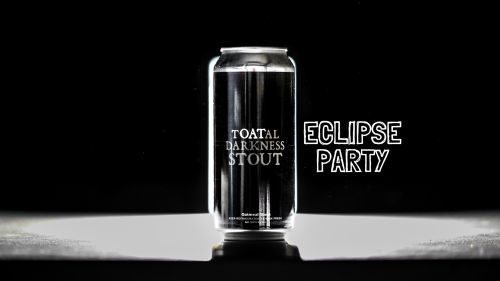 Black beer can that says Total Darkness Stout