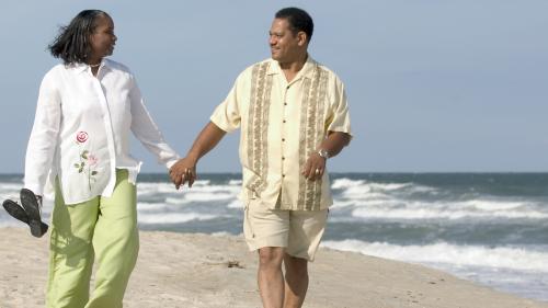 Couple walking along the beach