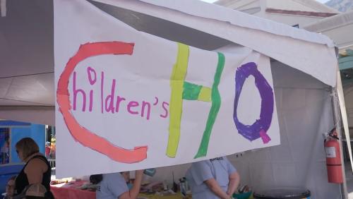 Banner of Children's HQ at Palm Springs Pride