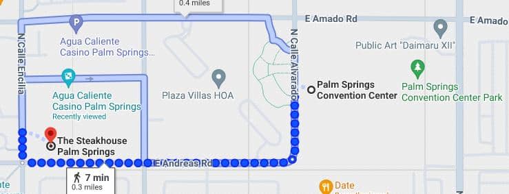 A screenshot of a digital map showing a walking route from Agua Caliente Casino Palm Springs to The Steakhouse in Palm Springs, indicated by a dotted blue line with a walking time of 7 minutes and a distance of 0.3 miles. Nearby landmarks include Plaza Villas HOA and the Palm Springs Convention Center.