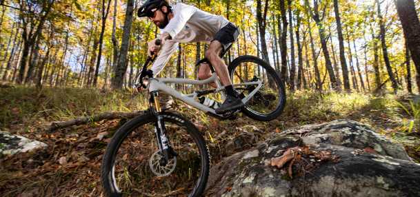 A racer rides his mountain bike over the rocky trails at Oak Mountain State Park.