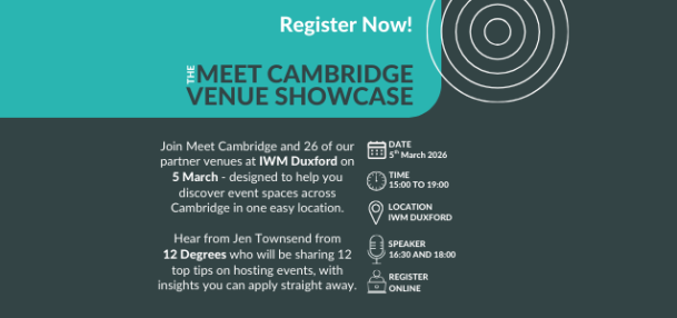 Delegates at an event talking to exhibitors around the room