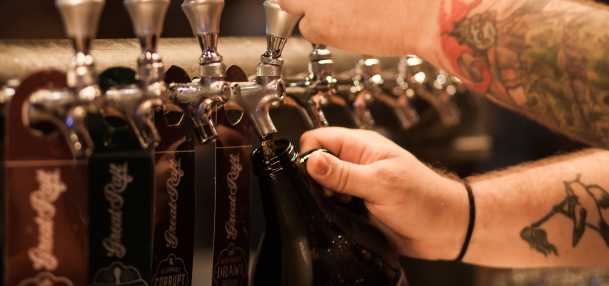 Beertender Pouring Draft Beer at Great Raft Brewing