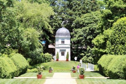 A wide shot of the bridge and tower in William Paca House and Garden