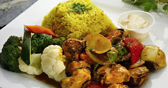 Plate with rice pilaf, vegetables and chicken