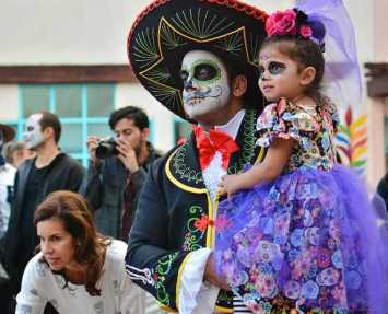 Father and daughter with traditional face painting