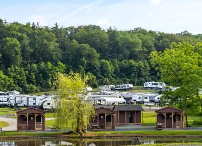Hidden Valley Campground - Cabins Sitting beside calm waters of their campground pond