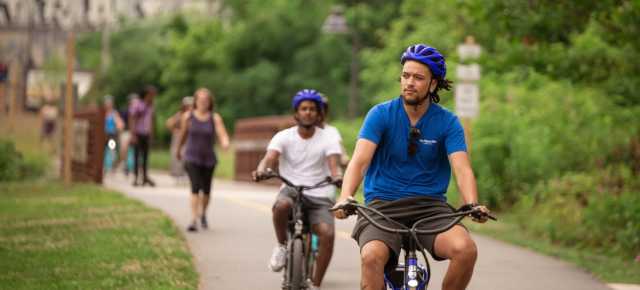 People riding bikes on the RAD Greenway