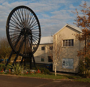 The exterior of the Museum of Cannock Chase, with its huge pit wheel