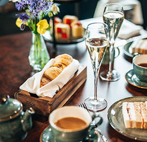 Afternoon tea with two glasses of prosecco