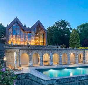 The beautiful pool and Plumicorn Restaurant at The Tawny Hotel, Staffordshire, all lit up as night falls