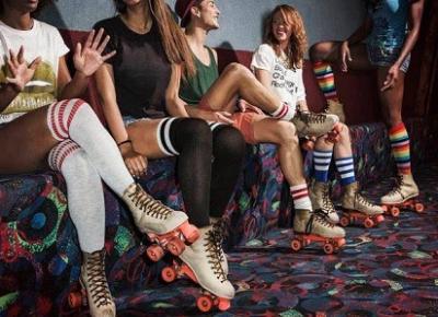 group of people wearing tube socks and roller skates