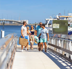Group of people getting ready for a boat ride at Laishley Marina in Punta Gorda, Florida
