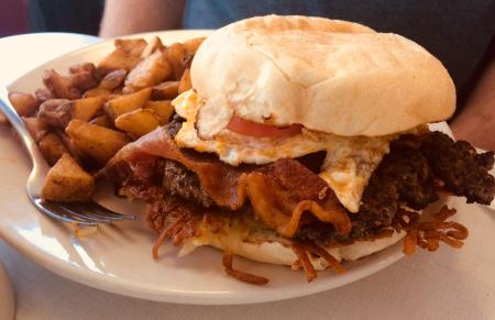 The Oasis Diner Brunch Burger is loaded with flavor!