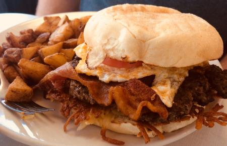 The Oasis Diner Brunch Burger is loaded with flavor!