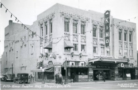 An image of a postcard showcasing the KiMo Theatre in 1950.