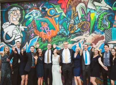 Wedding party in front of street art in Denver, Colorado