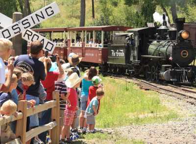 Train on a track before crowd at Colorado Railroad Museum