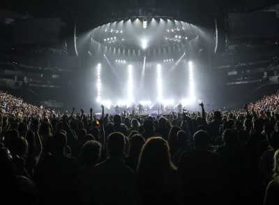 A light show delights the crowd at a music concert at Denver's Ball Arena