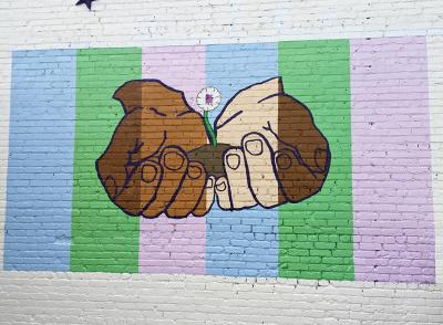 Colorful hands mural in Downtown Selma, NC.