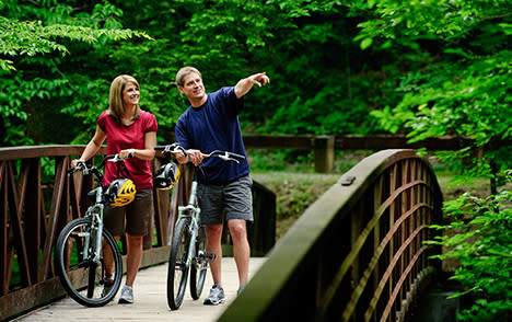 Couple Bicycling on Bridge Small