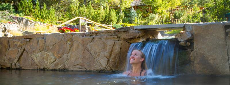 Soak under the waterfalls at Strawberry Park Hot Springs