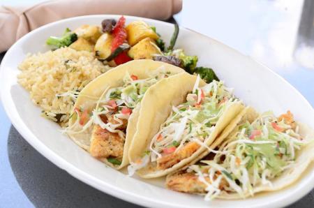 Fish Tacos plated at La Hacienda Ranch Frisco with rice and vegetables.