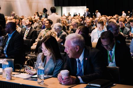 a group of people at a business or government conference meeting