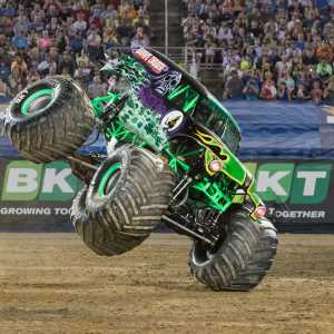 [ID: a photo of Grave Digger's purple and green monster truck. Monster Jam: September 28, 2024 - September 29, 2024]