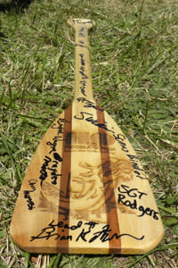 The team of Warriors signed their awards paddle.