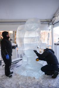 Men Carving an Abominable Snowman Out of Ice for Glacier Ice Bar & Lounge