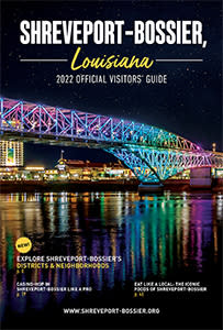 2022 Visitors' Guide to Shreveport-Bossier, Louisiana brochure front cover - LED-lit Bakowski Bridge of Lights on the Texas Street bridge over the Red River in the foreground, night skyline of Bossier City in background