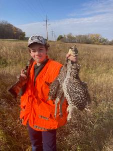 child holding grouse