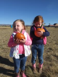 Girls with Pumpkins at the Pumpkin Walk
