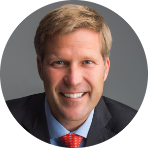 Portrait of Mayor Tim Keller, enclosed in a circle.