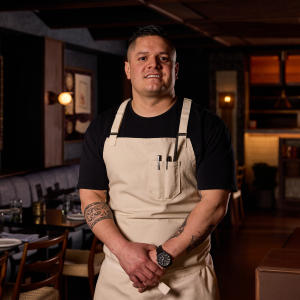 Chef Johnny Curiel stands with his apron on inside of his restaurant, Cozobi Fonda Fina, in Boulder.