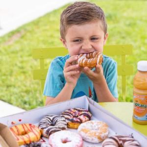Child Eating Duck Donuts