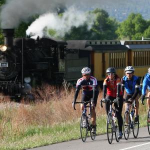 bike riders and the train