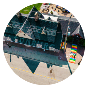 Over head drone shot of historic train station with 'Tilsonburg' spelled out in shingles