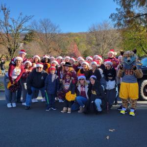 Students in Santa hats at the parade