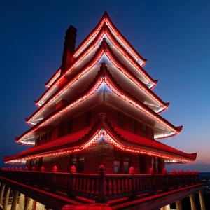 The Pagoda lit up at night with bright red lights