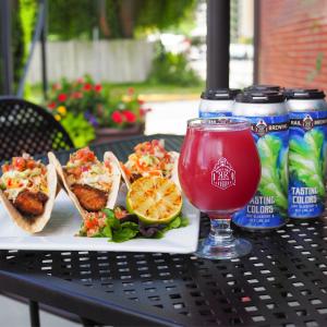 Picture of Rusty Rail Brewery Patio with beer and plate of tasty food on display